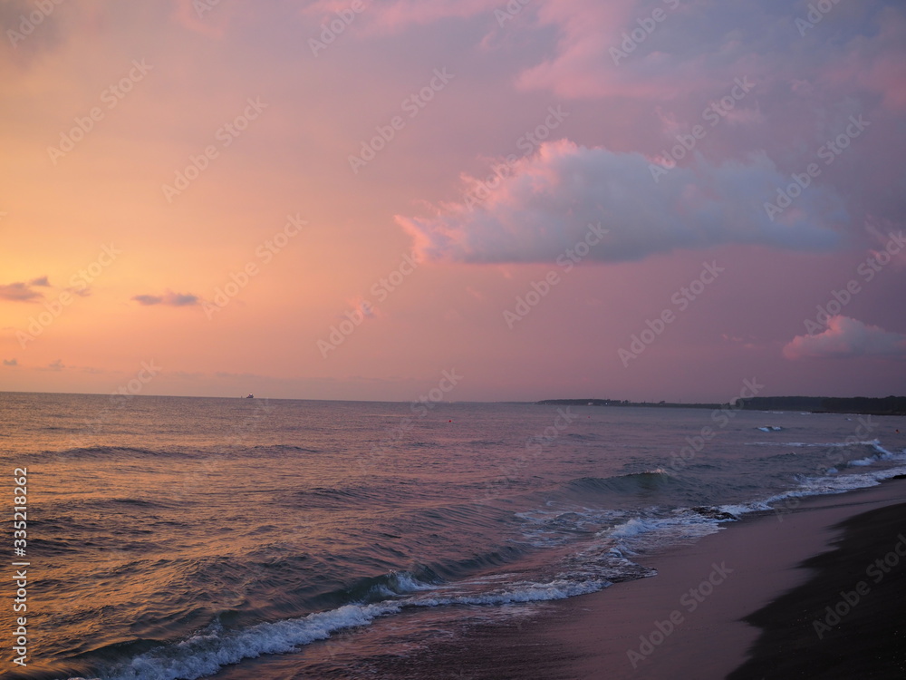 picturesque Pink sunset on lake beach sea sand beautiful colors in the sky clouds