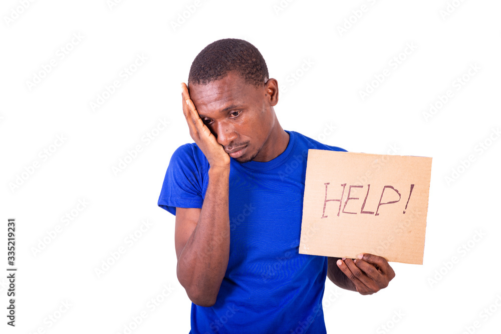 portrait of a worried young man holding a poster. portrait of a worried young man holding a poster.