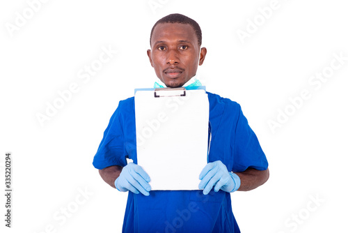 young male doctor holding a clipboard. © vystekimages