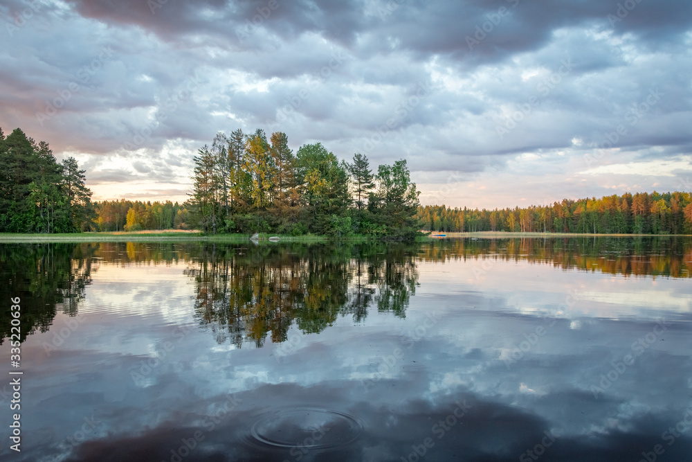 sunset in summer by the lake in Finland