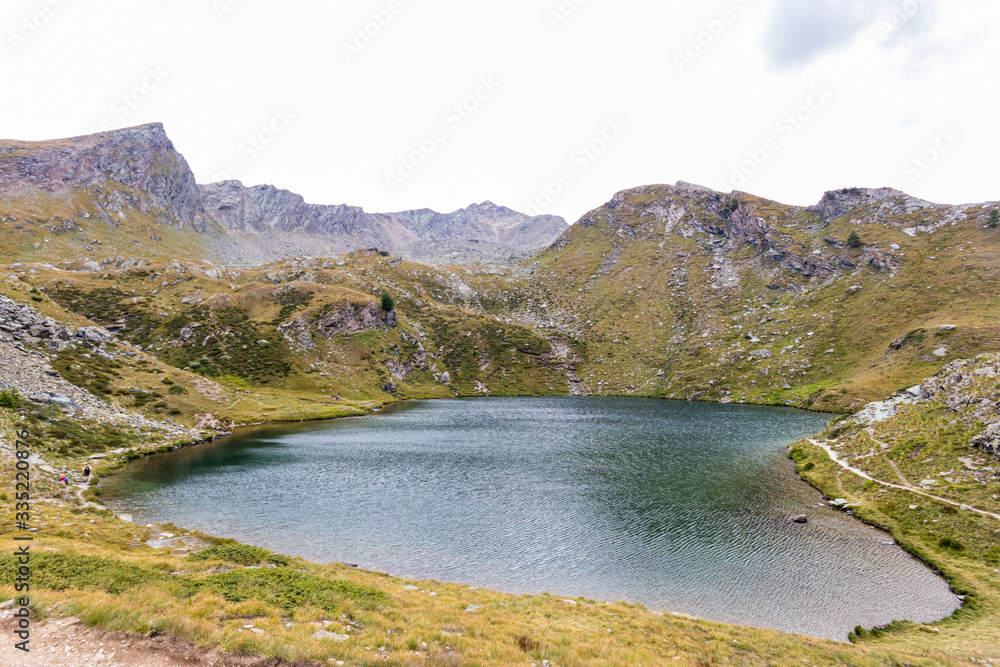 green mountain lake.  Lago di Loie in summer, Lillaz, Cogne, Aosta valley, Italy