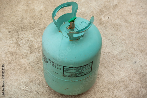 A tank of Refrigerant isolated,Old Gas bottle on the floor.