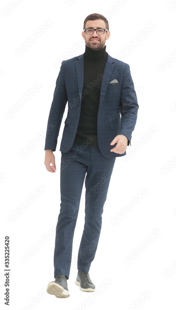 in full growth. confident business man taking a step forward in full growth. confident business man taking a step forward