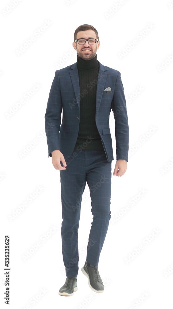 in full growth. confident business man taking a step forward in full growth. confident business man taking a step forward