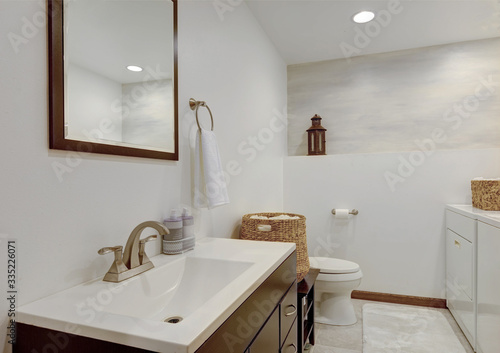 Simple white new cute bathroom interior with natural rustic touches.