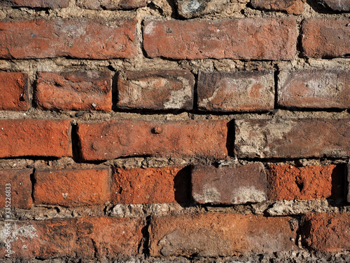 wall of old damaged red brick