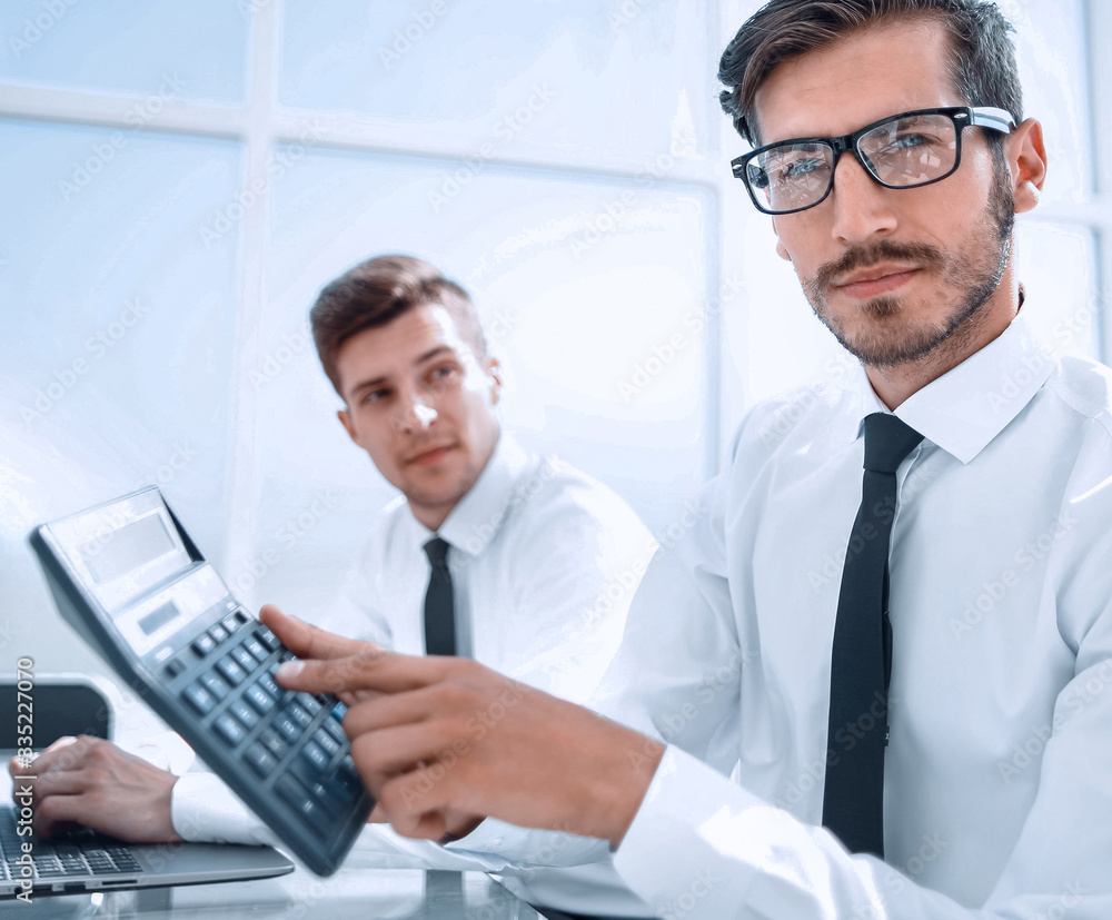 Fototapeta premium Smiling accountants discussing reports at the office