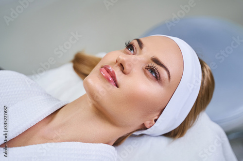 Young pretty woman at cosmetologist stock photo
