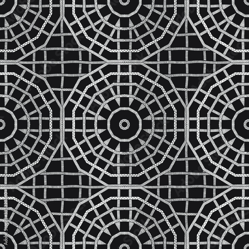 Seamless geometric black and white monochrome hand drawn kaleidoscope vector pattern. Gift wrapping paper  interior  cloth  fabric or web design.