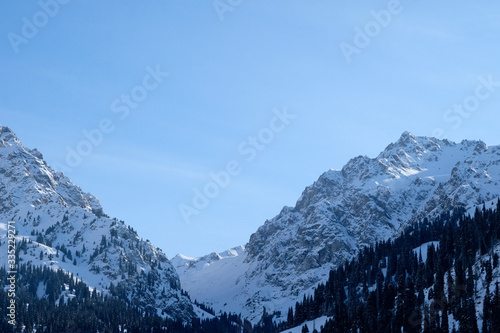 Winter mountains covered with snow landscape. Tien shan mountains in winter.