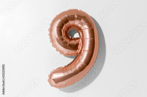 Number 9, Rose gold foil balloon number nine isolated on a white background with Clipping Path