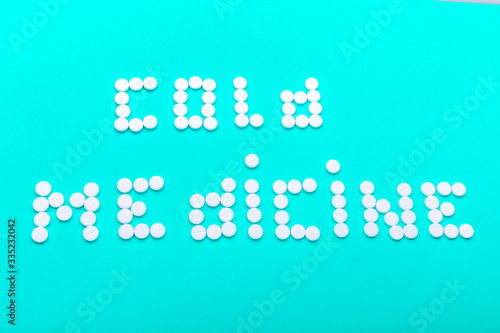 The inscription  medication  made of pills on a green background.