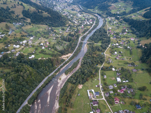 Aerial view village Kryvorivnia in Carpathians mountains at summer photo