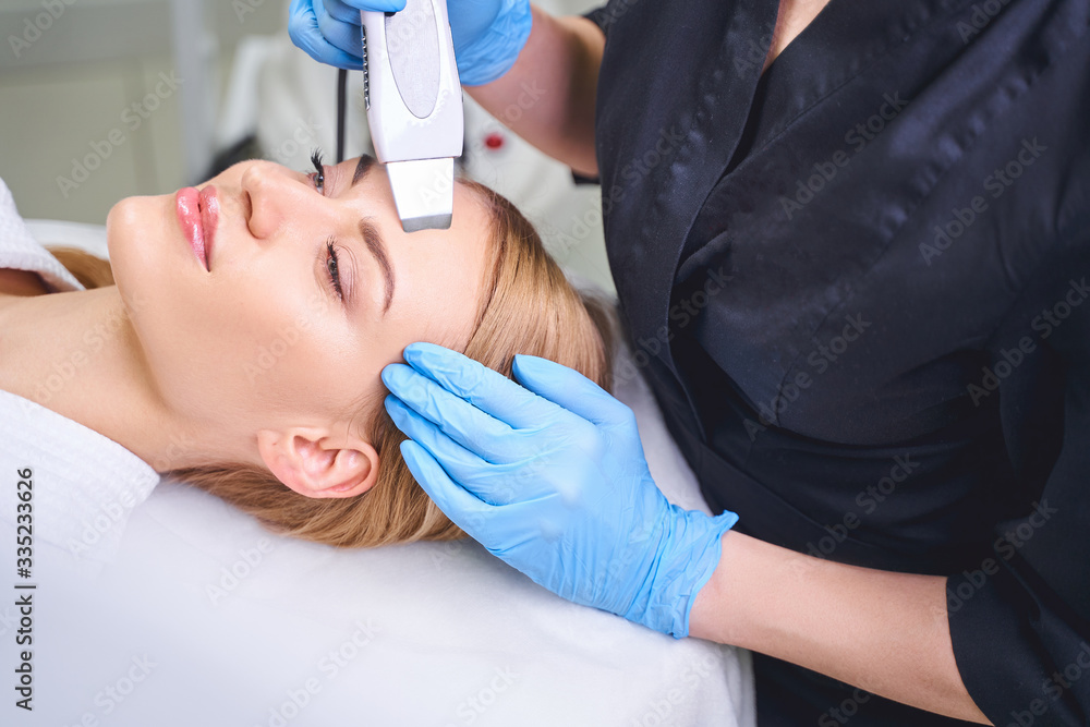 Cosmetologist doing facial for woman stock photo Cosmetologist doing facial for woman stock photo