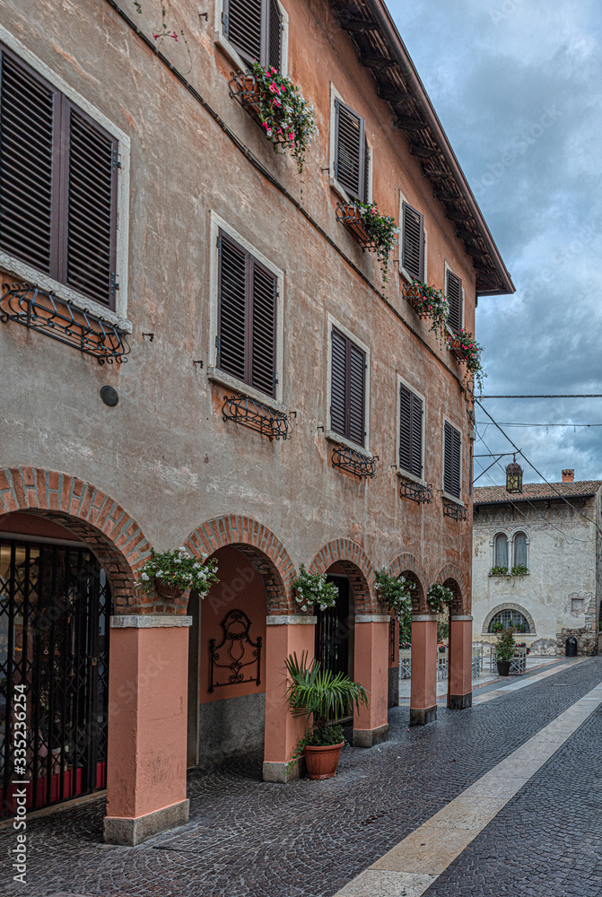 Italian street old architecture in Lazise, town on Garda lake