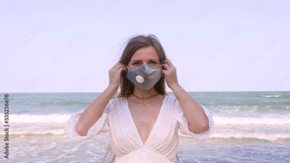 Serious Travel Woman Looking at Camera and Wearing Protection Medical Health Mask on Face. Concept of Fight Against Chinese Covid-19 Coronavirus in Tropical Country, Virus Protection