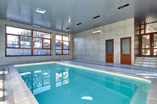 beautiful indoor pool without people © oxanas