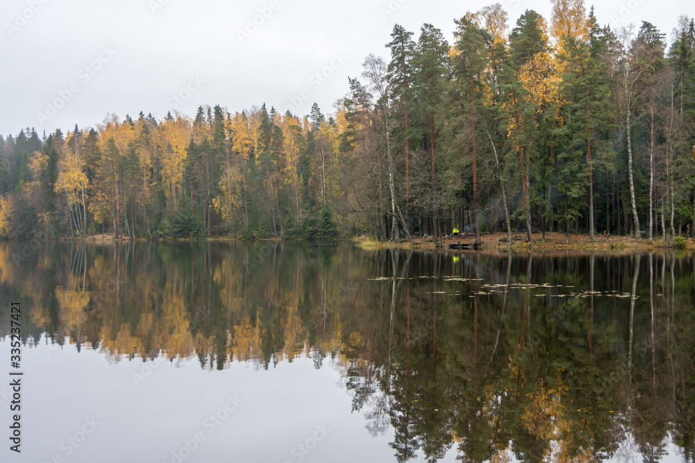 Calm lake and forest in fall colors, Finland