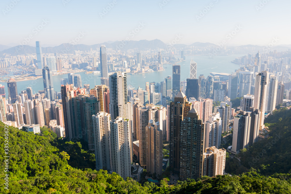 Hong Kong's beautiful skyline. The Peak Tower deck view (The Peak) on a sunny day, Hong Kong, China. Hong Kong Island and Kowloon's skyscrapers & South China Sea. Near Victoria Peak.