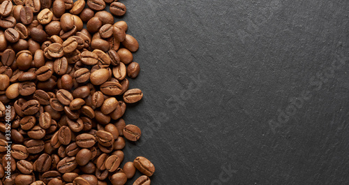 Roasted coffee beans background. Top view © spaxiax