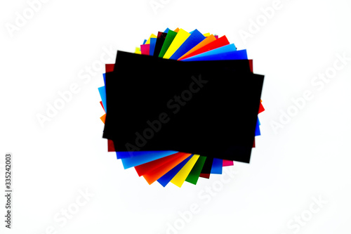 Stack of Coloured Cast Acrylic Sheet on white background, top view photo