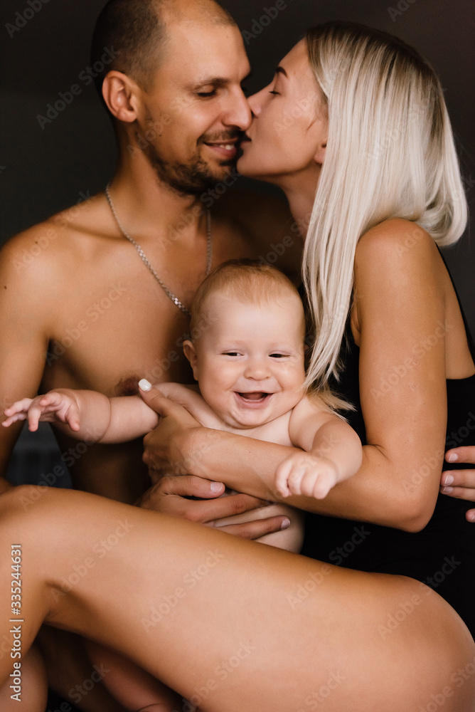 family, mother, father and children, sons, at home, warm family relationships, hug, kiss children, enjoy life together, games with the whole family, stay home family, mother, father and children, sons, at home, warm family relationships, hug, kiss children, enjoy life together, games with the whole family, stay home