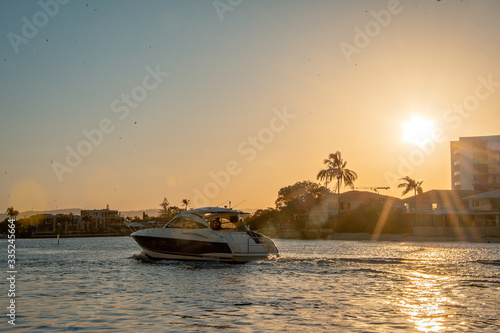 speedboat on the river with sunset