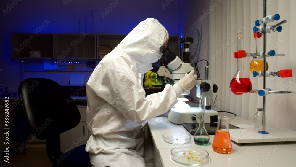 Scientist examining samples with microscope Scientist examining samples with microscope