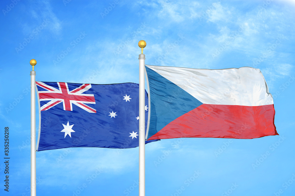 Australia and Czech Republic two flags on flagpoles and blue cloudy sky