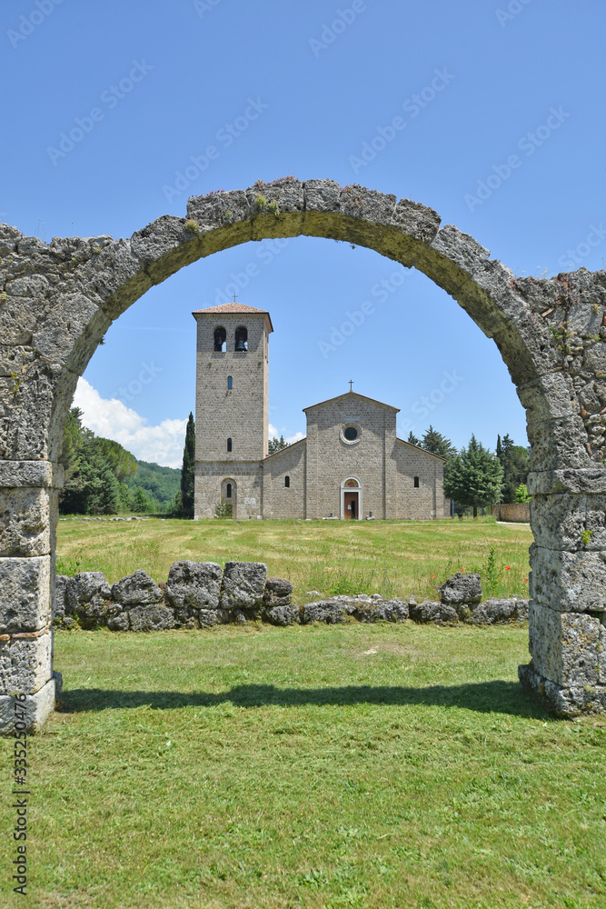 Abbey of San Vincenzo al Volturno, Italy, 06/02/2018. Facade of the church seen from the arches