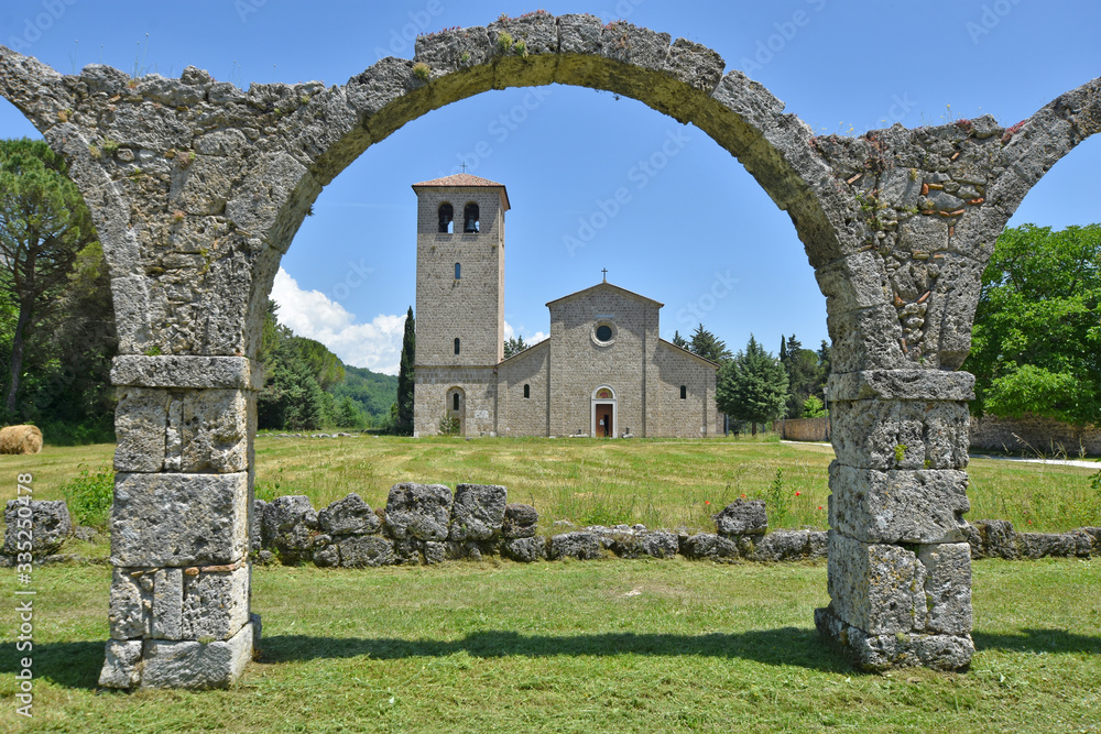Abbey of San Vincenzo al Volturno, Italy, 06/02/2018. Facade of the church seen from the arches