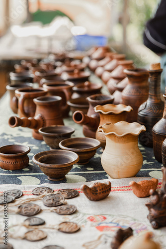 Handmade clay brown pots with blurry background