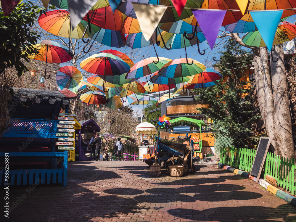 Naklejka premium colorful umbrellas in the street of Balat