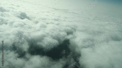 Passing over the forest over the clouds photo