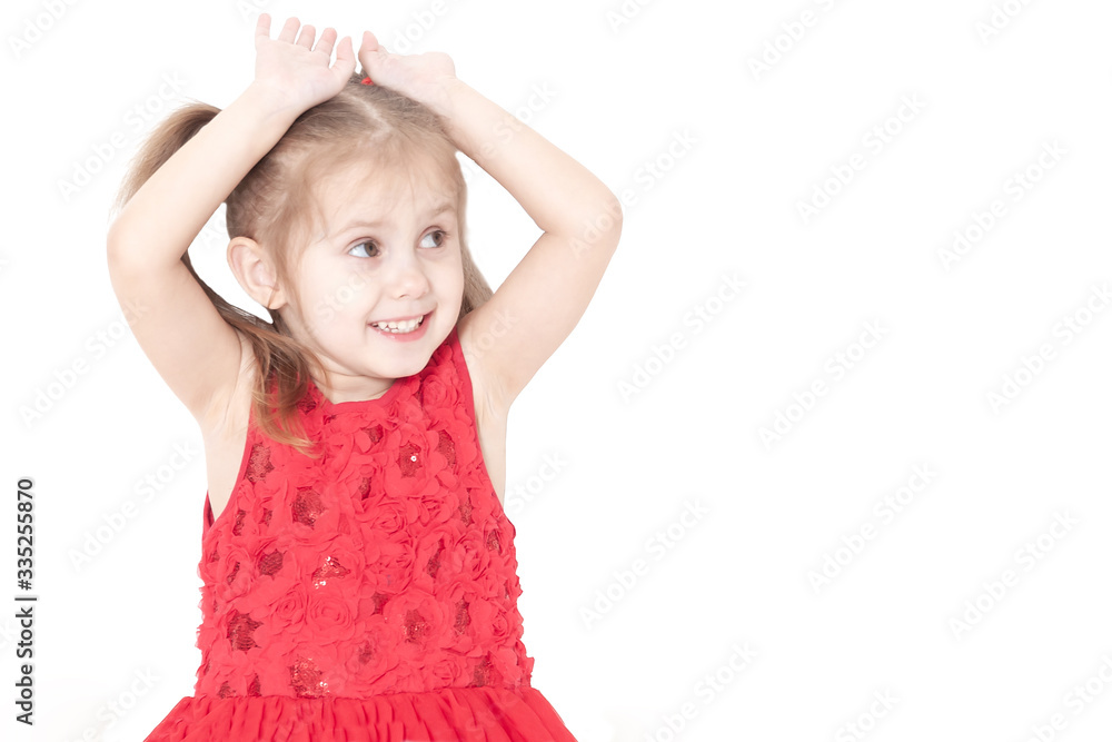 portrait of a smiling three year old little girl in a red dress, white background portrait of a smiling three year old little girl in a red dress, white background