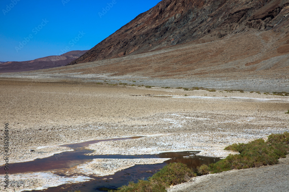 California / USA - August 22, 2015: The salt lake landscape in Death Valley National Park, California, USA California / USA - August 22, 2015: The salt lake landscape in Death Valley National Park, California, USA