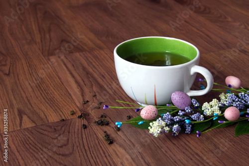 easter green tea in a mug on a dark background