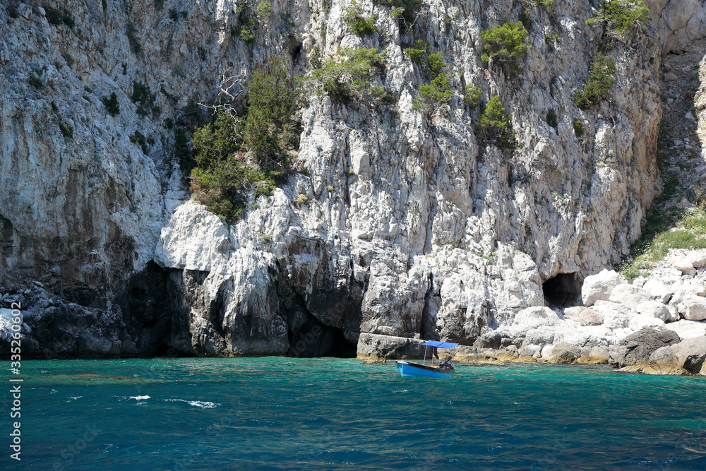 Capri, Italy: Lounging on the beautiful waters in a small boat in the summertime.