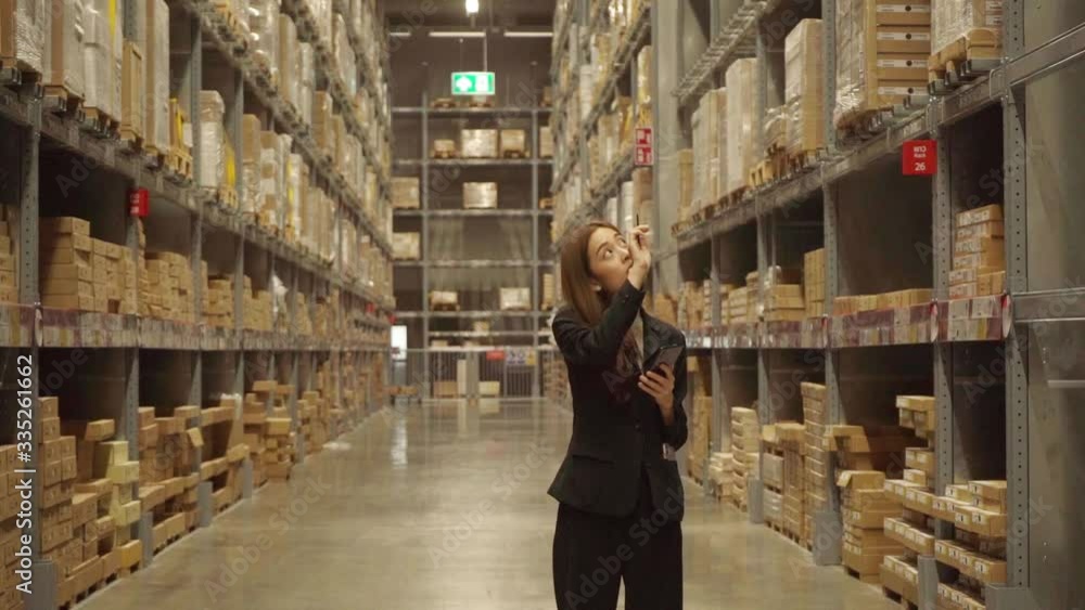 An Asian female worker is checking the goods in the warehouse. In order to be distributed to customers of the company
An Asian female worker is checking the goods in the warehouse. In order to be distributed to customers of the company