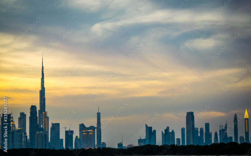 Unique view of Dubai city from Las Al Khor Wildlife Sanctuary. during sunset, golden hour, busrj khalifa,