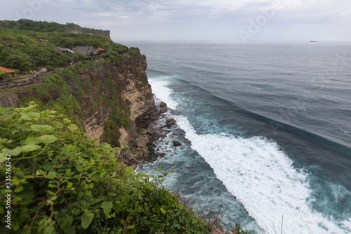 View from the cliff to the cliffs and the raging ocean