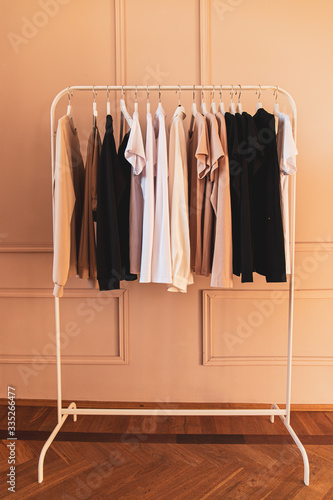 wardrobe with clothes on hangers