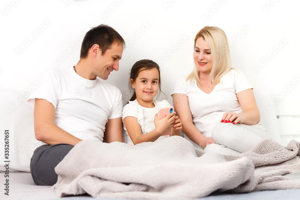 Animated family buying online lying down on bed at home Animated family buying online lying down on bed at home
