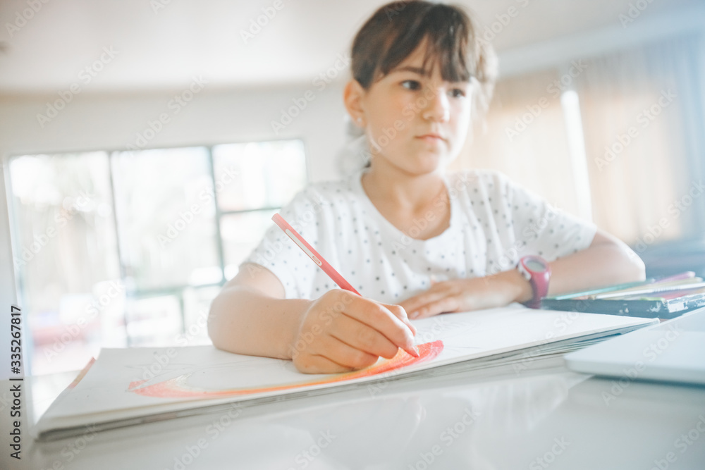 young caucasian girl drawing at home, on-line art calss, home schooling, stay home education young caucasian girl drawing at home, on-line art calss, home schooling, stay home education