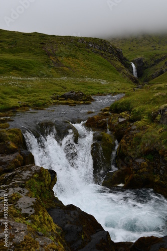 waterfall in the mountains in Iceland