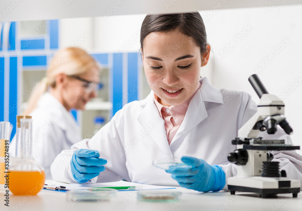 Female scientists working in the laboratory Female scientists working in the laboratory