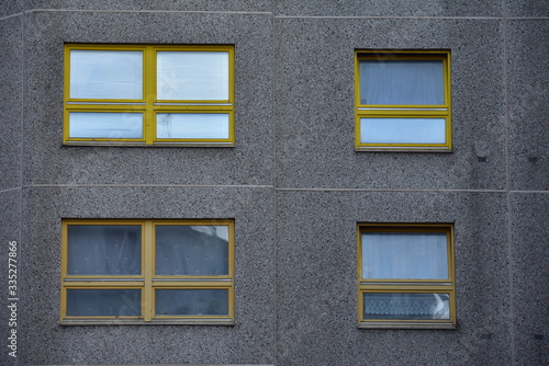 Grey building with yellow windows in Kreuzberg Berlin germany