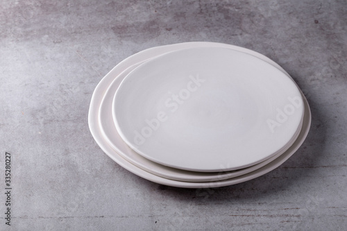 Empty blank white ceramic dish on Cement Board