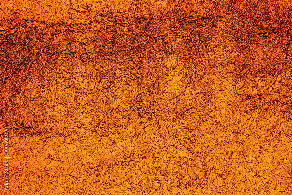 Copper colored wall texture background with textures of different shades of copper or bronze Copper colored wall texture background with textures of different shades of copper or bronze