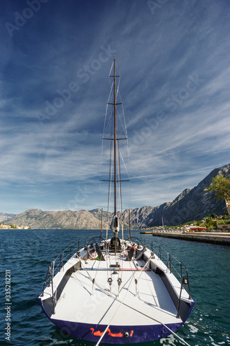 Sunny morning panoramic view of beautiful yacht at Kotor bay near old town, Montenegro.
